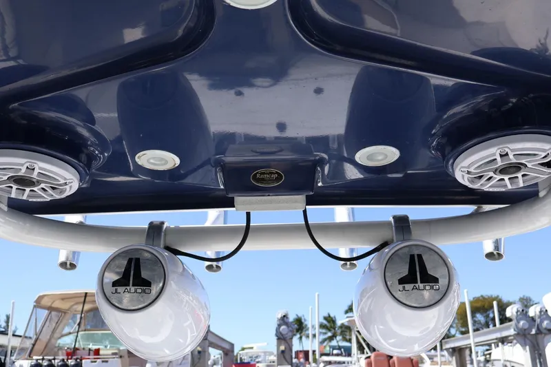 Slide: The Image of 2011 Everglades 320 Center Console with JL Audio speakers and blue canopy. - 12
