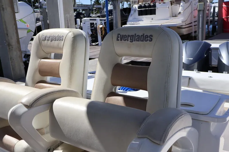 Slide: The Image of 2011 Everglades 320 Center Console boat seats at marina. - 14