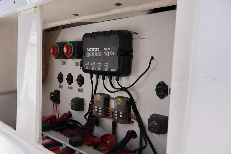 Slide: The Image of Electrical panel of 2011 Everglades 320 Center Console with NOCO Genius charger. - 15