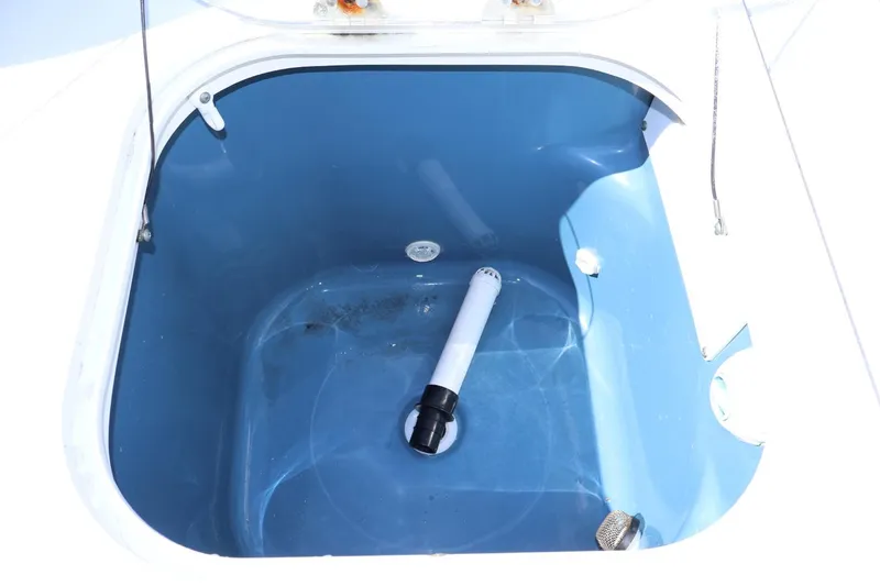 Slide: The Image of Livewell of 2011 Everglades 320 Center Console boat, featuring blue interior. - 6