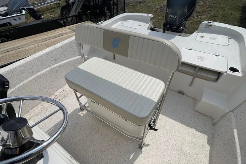 Slide: The Image of 2019 Carolina Skiff 198 DLV boat interior with steering wheel and seating. - 11
