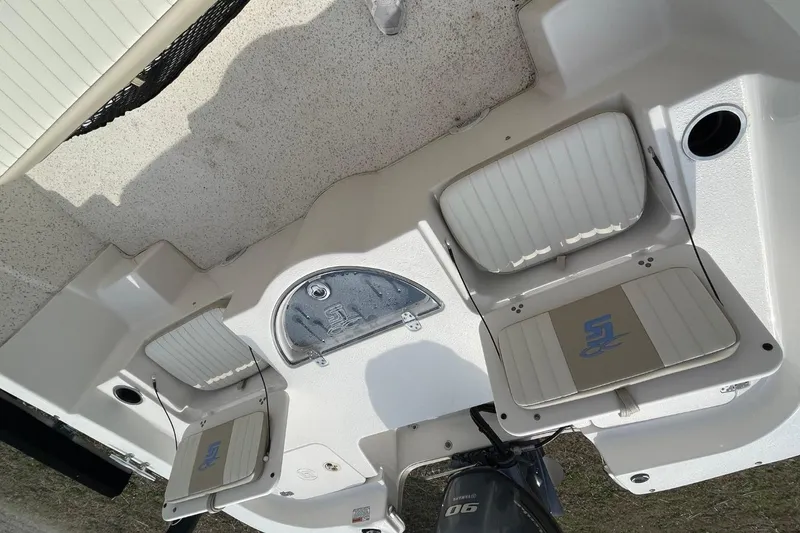 Slide: The Image of 2019 Carolina Skiff 198 DLV boat interior with seating and storage compartments. - 15