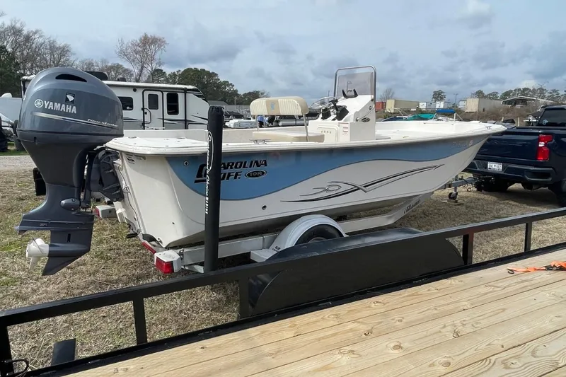 Slide: The Image of 2019 Carolina Skiff 198 DLV boat with Yamaha outboard motor on trailer. - 2
