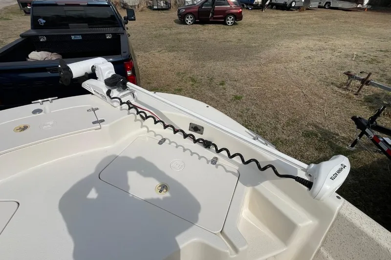 Slide: The Image of 2019 Carolina Skiff 198 DLV boat with Minn Kota trolling motor on deck. - 20