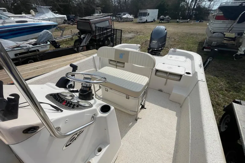 Slide: The Image of 2019 Carolina Skiff 198 DLV boat interior with steering console and seating. - 29