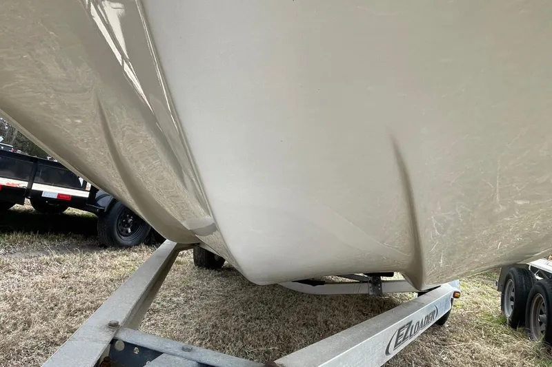 Slide: The Image of 2019 Carolina Skiff 198 DLV boat hull on trailer, side view. - 32