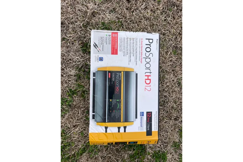Slide: The Image of ProSport HD12 battery charger box on grass, compatible with 2019 Carolina Skiff 198 DLV. - 33
