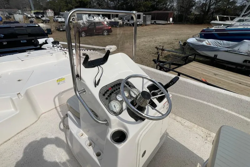 Slide: The Image of 2019 Carolina Skiff 198 DLV boat console with steering wheel and controls. - 9