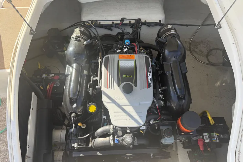 Slide: The Image of Engine compartment of 2015 Chaparral 244 Sunesta boat, featuring a 350 MAG engine. - 26