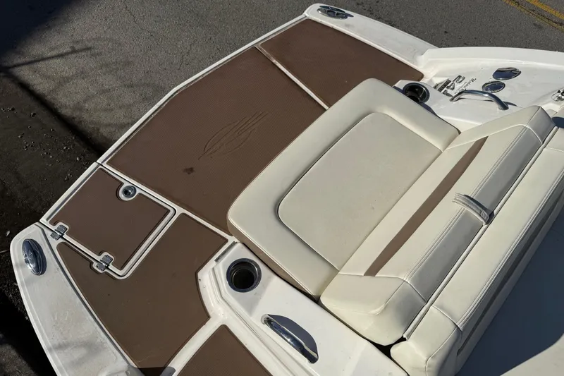 Slide: The Image of 2015 Chaparral 244 Sunesta boat deck with brown and white seating. - 27