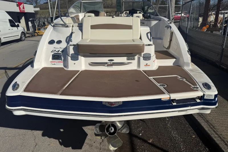 Slide: The Image of 2015 Chaparral 244 Sunesta boat rear view with swim platform and seating. - 28