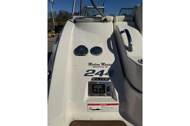 Slide: The Image of 2015 Chaparral 244 Sunesta boat dashboard with controls and branding details. - 29