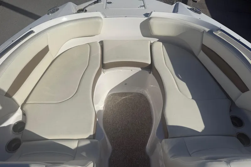 Slide: The Image of 2015 Chaparral 244 Sunesta boat interior with spacious seating and cup holders. - 8