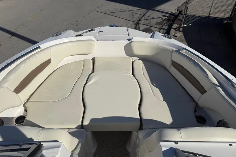 Slide: The Image of 2015 Chaparral 244 Sunesta boat with spacious, cushioned seating area. - 9