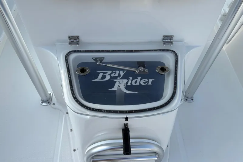 Slide: The Image of 2026 Bay Rider 2460 FS Skiff livewell with logo, featuring sturdy construction and sleek design. - 12