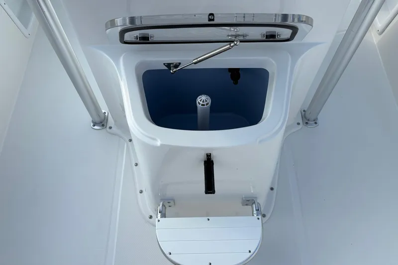 Slide: The Image of Bay Rider 2460 FS Skiff 2026 boat interior with storage compartment and step. - 13
