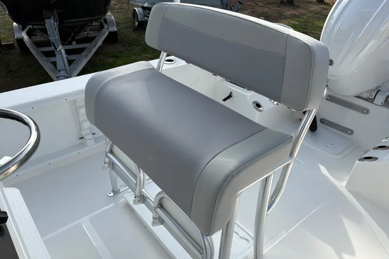 Slide: The Image of Bay Rider 2460 FS Skiff 2026 boat seat with sleek gray upholstery and sturdy metal frame. - 9