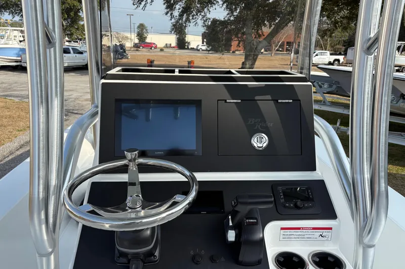 Slide: The Image of Bay Rider 2460 FS Skiff 2026 helm with steering wheel and display. - 8