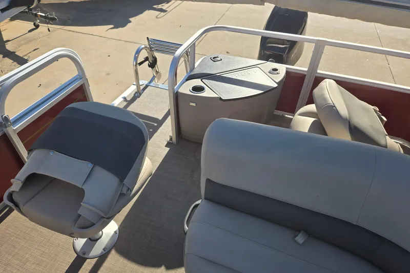 Slide: The Image of 2023 Sun Tracker Bass Buggy 18 DLX pontoon boat interior with seating and console. - 14