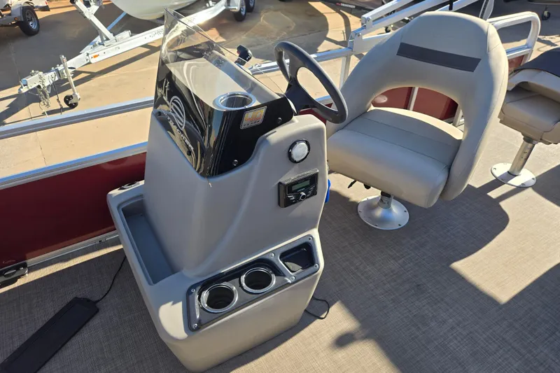 Slide: The Image of 2023 Sun Tracker Bass Buggy 18 DLX boat interior with steering console and seating. - 7