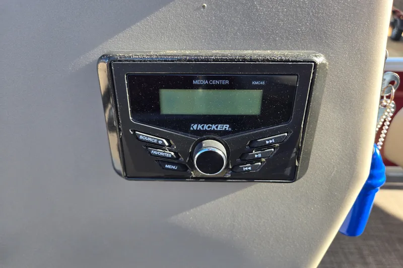 Slide: The Image of Kicker media center on 2023 Sun Tracker Bass Buggy 18 DLX boat dashboard. - 9