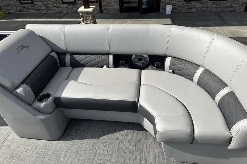 Slide: The Image of Luxurious seating on 2021 Bennington 21 SSBX pontoon boat, featuring elegant gray upholstery. - 10