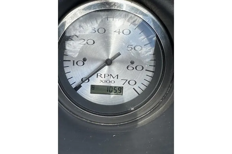 Slide: The Image of Close-up of a 2021 Bennington 21 SSBX RPM gauge displaying 1059 RPM. - 13