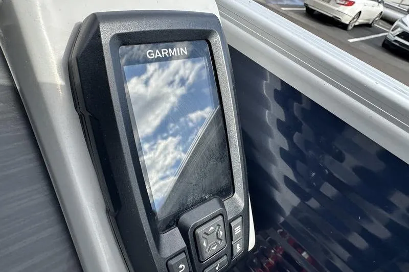 Slide: The Image of Garmin device on 2021 Bennington 21 SSBX boat, reflecting cloudy sky. - 15