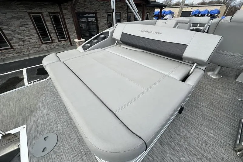 Slide: The Image of 2021 Bennington 21 SSBX boat with luxurious gray seating and modern design. - 21