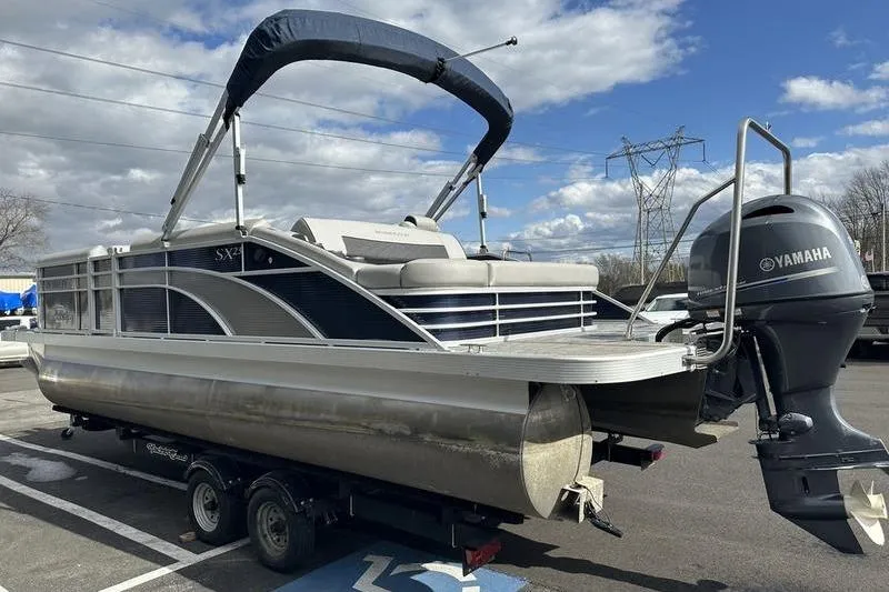 Slide: The Image of 2021 Bennington 21 SSBX pontoon boat with Yamaha engine on trailer. - 3