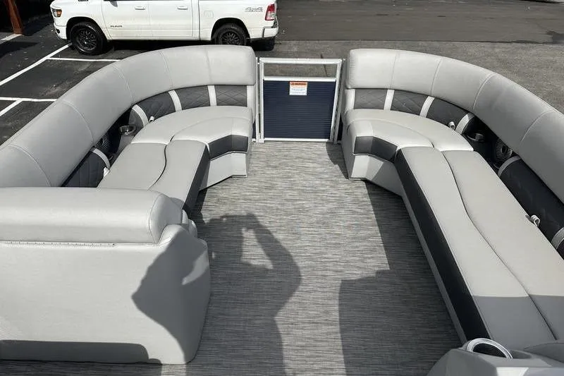 Slide: The Image of 2021 Bennington 21 SSBX pontoon boat interior with gray seating and spacious layout. - 6