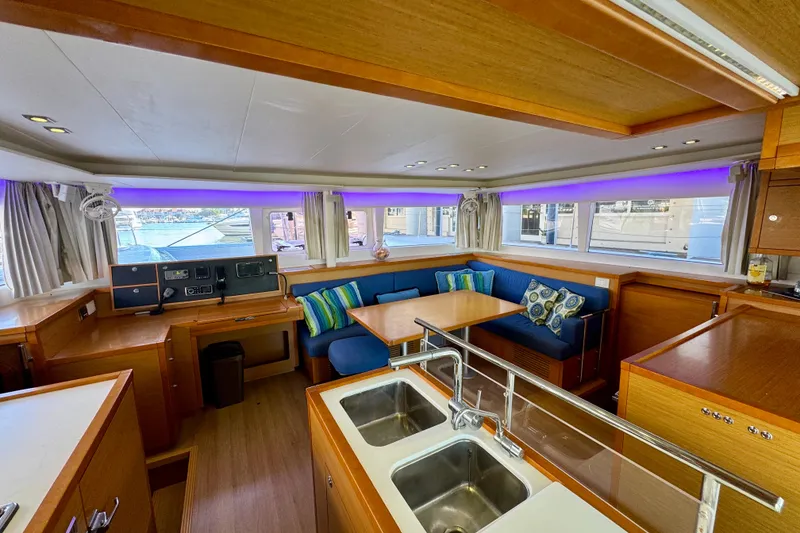 Slide: The Image of Luxurious interior of 2012 Lagoon 450 F catamaran with modern kitchen and seating area. - 11