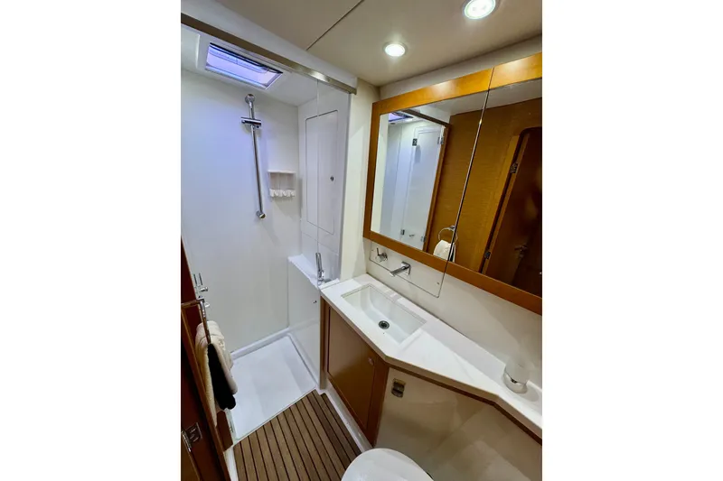 Slide: The Image of Luxurious bathroom in 2012 Lagoon 450 F yacht with modern fixtures and wooden accents. - 25