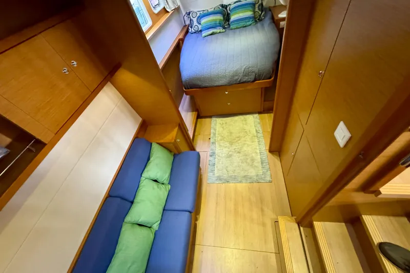 Slide: The Image of Interior of 2012 Lagoon 450 F yacht with cozy bedroom and seating area. - 29