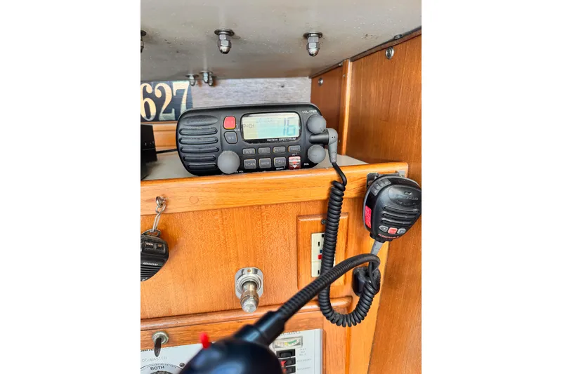 Slide: The Image of VHF radio equipment inside a 1995 Catalina 36 MkII sailboat cabin. - 11