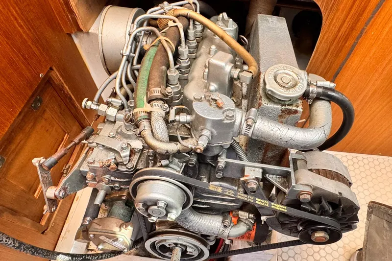 Slide: The Image of Engine of a 1995 Catalina 36 MkII sailboat, showcasing intricate mechanical components. - 14