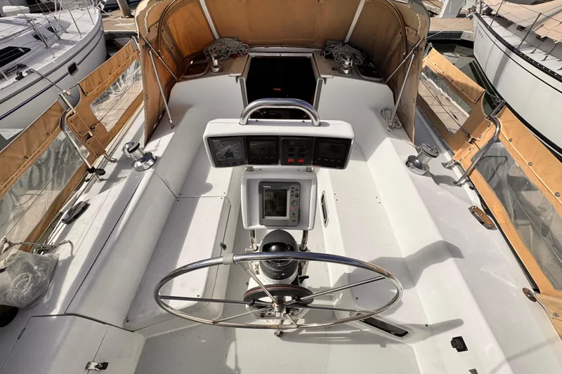 Slide: The Image of Cockpit of a 1995 Catalina 36 MkII sailboat with steering wheel and navigation instruments. - 17