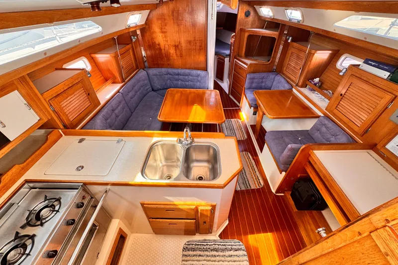 Slide: The Image of Interior of 1995 Catalina 36 MkII sailboat with wood finish and cozy seating. - 2