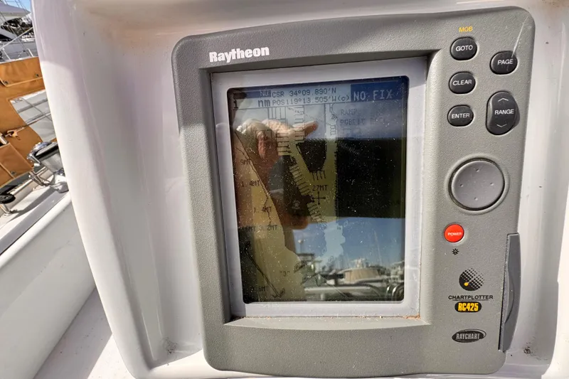 Slide: The Image of Raytheon chartplotter on 1995 Catalina 36 MkII sailboat, displaying navigation data. - 20