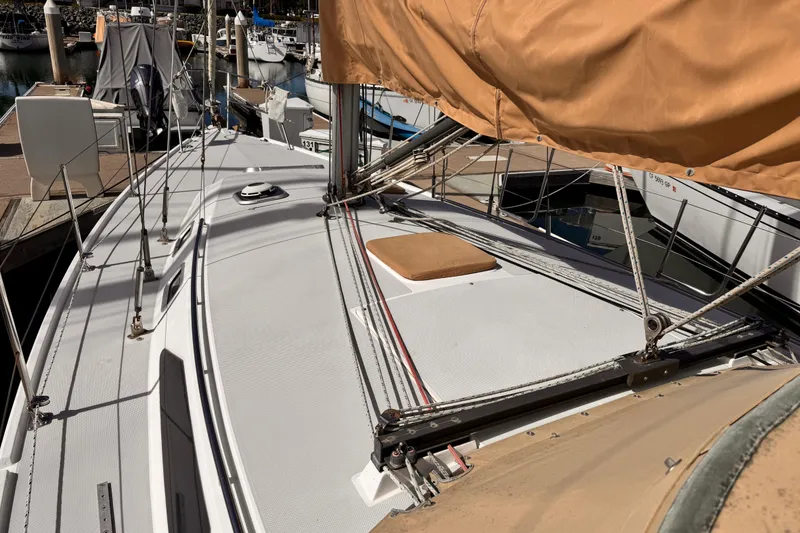 Slide: The Image of Sailboat deck of 1995 Catalina 36 MkII, docked at marina with covered sails. - 24