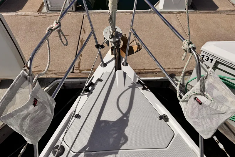 Slide: The Image of Bow of a 1995 Catalina 36 MkII sailboat docked, featuring ropes and deck details. - 25