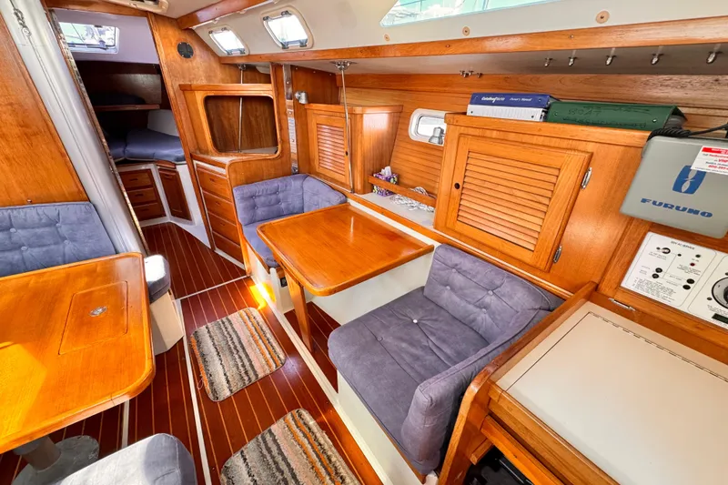 Slide: The Image of Interior of a 1995 Catalina 36 MkII sailboat with wood finish and cozy seating. - 3