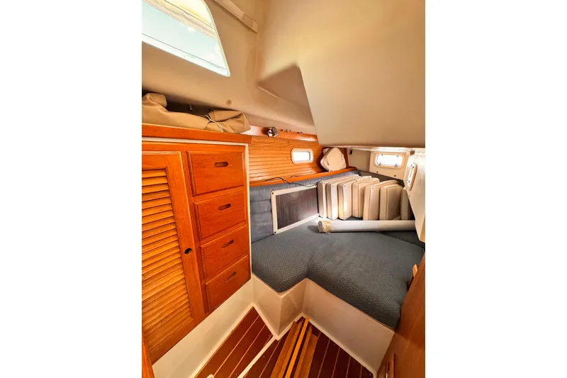 Slide: The Image of Cozy cabin interior of 1995 Catalina 36 MkII sailboat with wooden storage and bedding. - 9