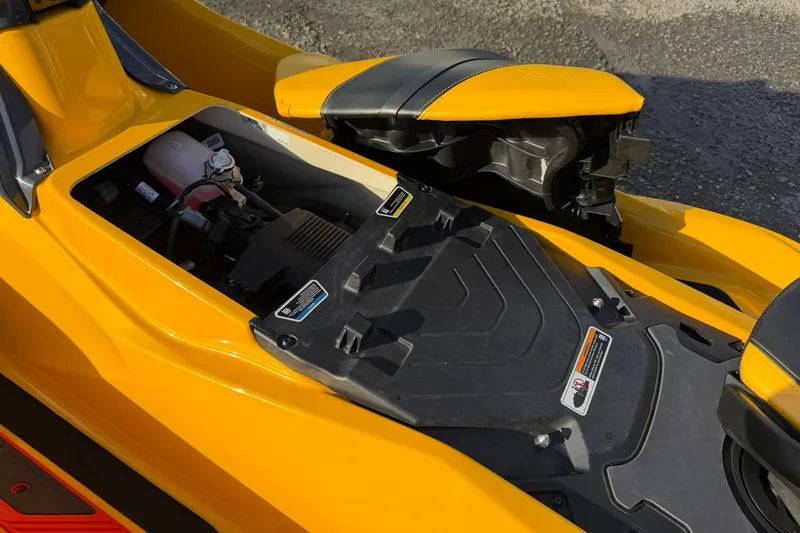 Slide: The Image of 2023 Sea-Doo RXT-X 300 engine compartment with yellow exterior detailing. - 14