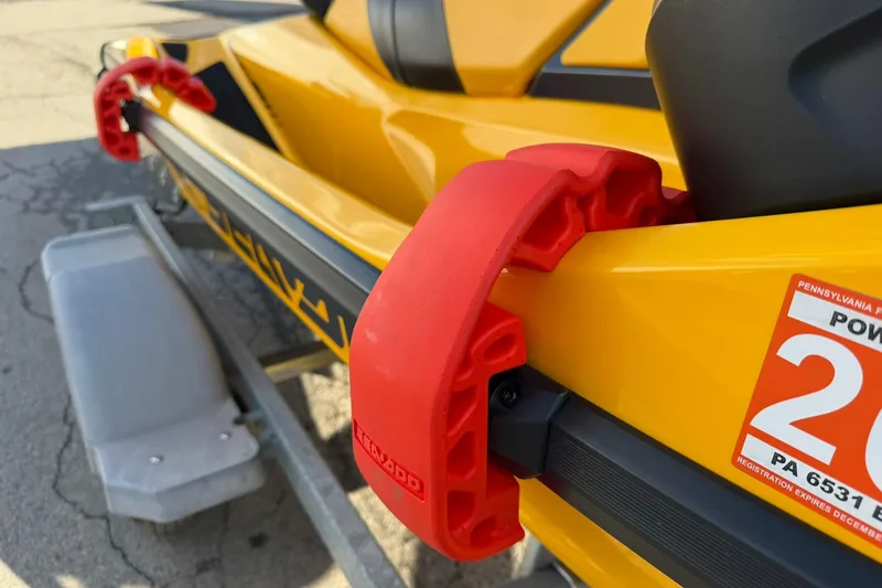 Slide: The Image of 2023 Sea-Doo RXT-X 300 in yellow with red bumper, on a trailer. - 15