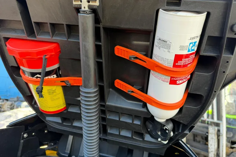 Slide: The Image of 2023 Sea-Doo RXT-X 300 storage compartment with safety equipment and fire extinguisher. - 17