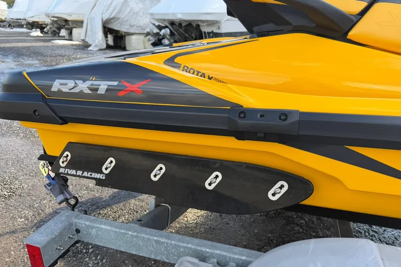 Slide: The Image of 2023 Sea-Doo RXT-X 300 jet ski with Riva Racing components on a trailer. - 2