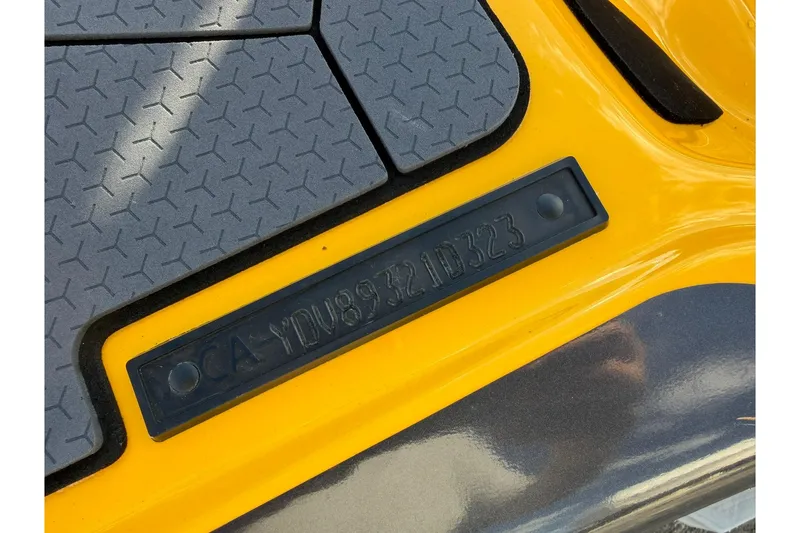 Slide: The Image of Close-up of 2023 Sea-Doo RXT-X 300 hull identification number on yellow surface. - 20