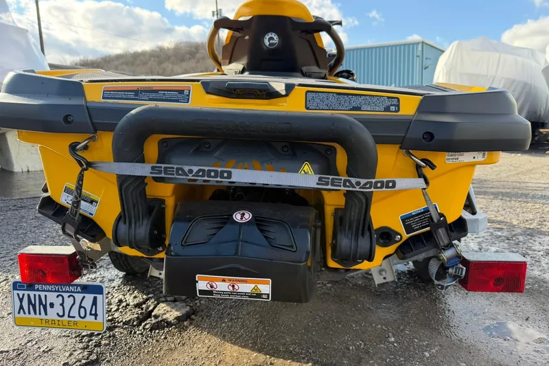 Slide: The Image of 2023 Sea-Doo RXT-X 300 rear view, yellow, parked with Pennsylvania trailer plate. - 6