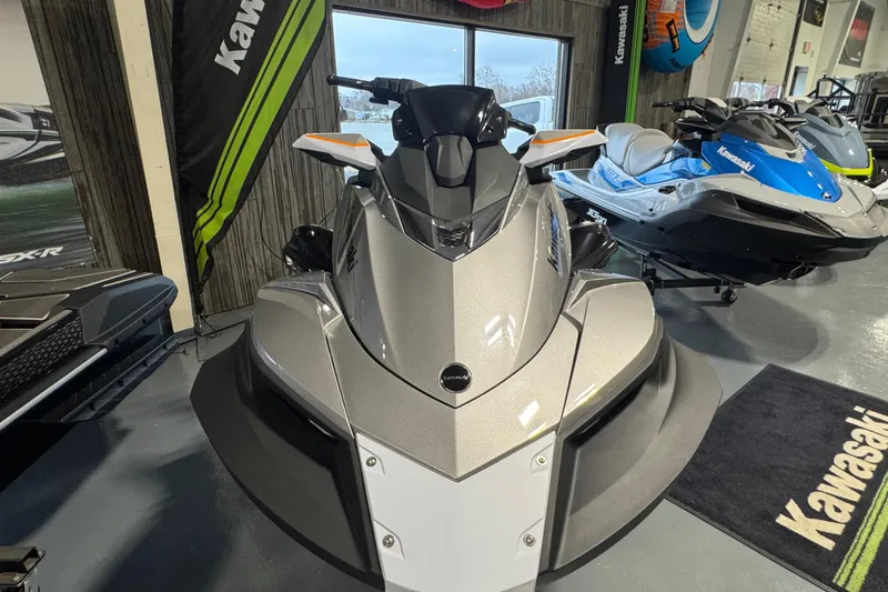 Slide: The Image of 2026 Kawasaki STX160LX jet ski in showroom, front view, sleek design. - 3